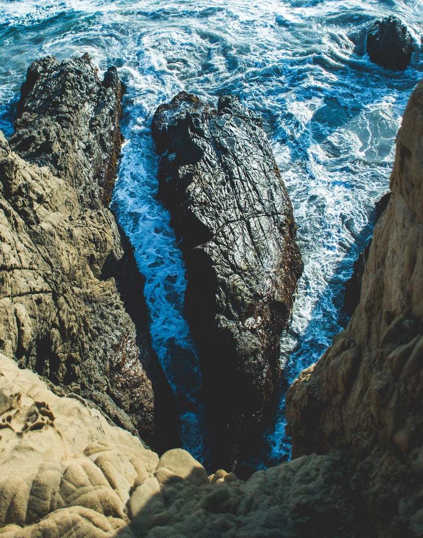 Decorative image: looking down from steep rocks